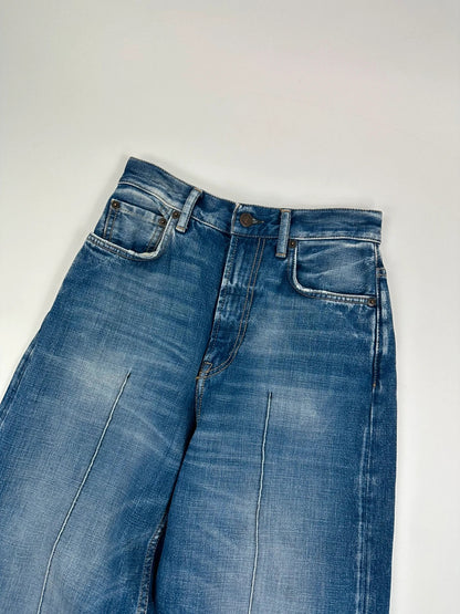 Acne Studios blue wide leg denim pants with subtle logo detailing and vintage style.