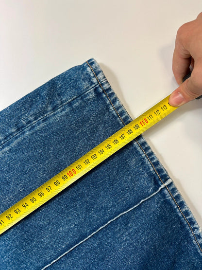 Acne Studios blue wide leg denim pants with subtle logo detailing and vintage style.