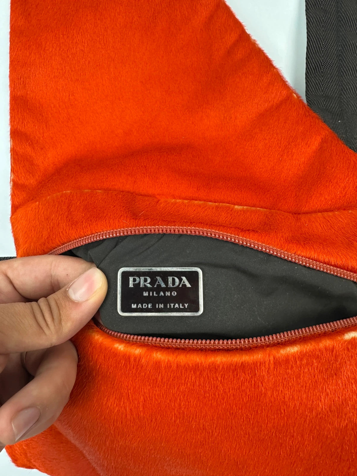 Prada orange fur crossbody sling bag with logo detail from FW99 collection.