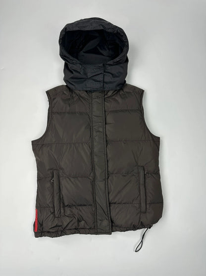 Prada brown puffer vest with retractable hood and linearossa logo details.