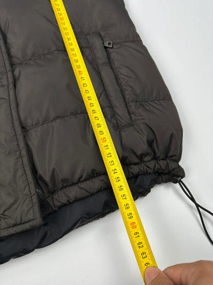 Prada brown puffer vest with retractable hood and linearossa logo details.