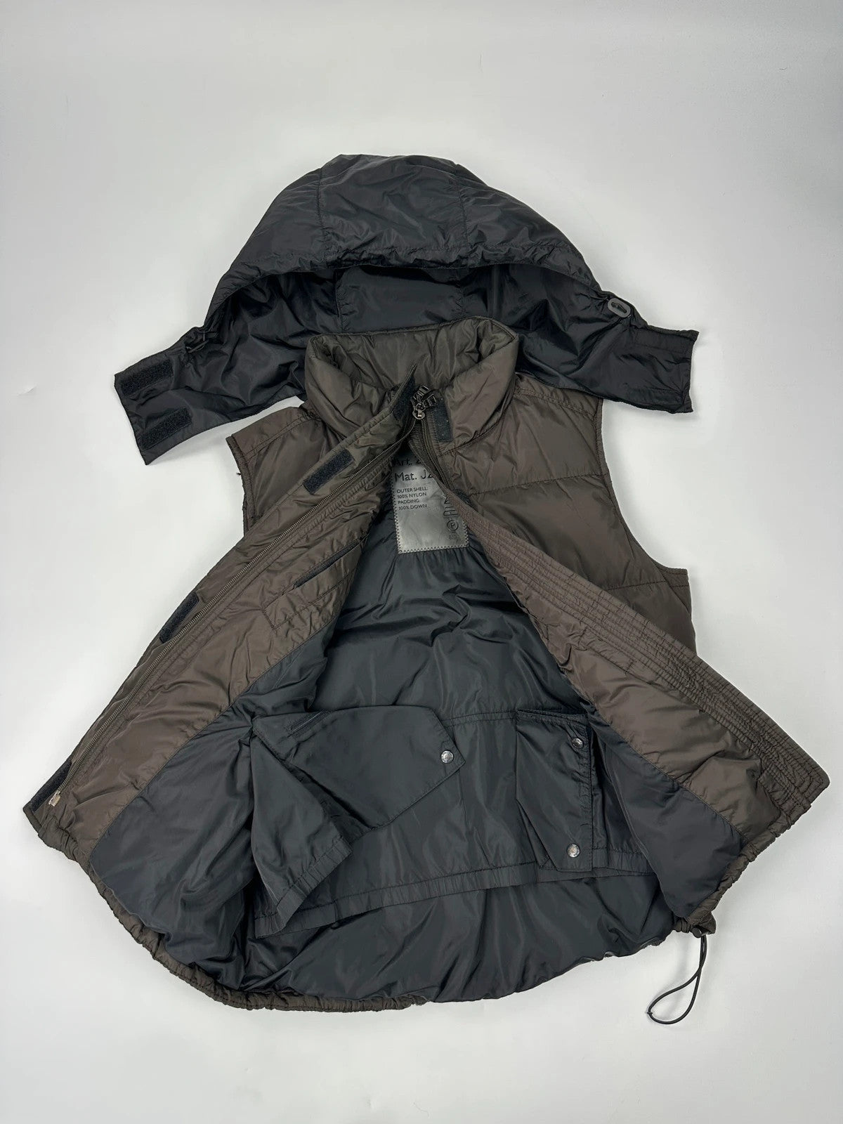 Prada brown puffer vest with retractable hood and linearossa logo details.