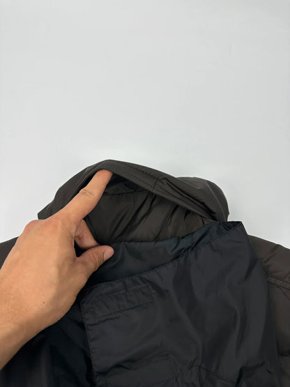 Prada brown puffer vest with retractable hood and linearossa logo details.