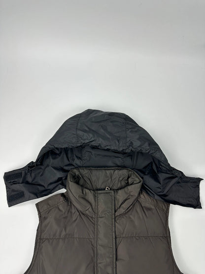 Prada brown puffer vest with retractable hood and linearossa logo details.