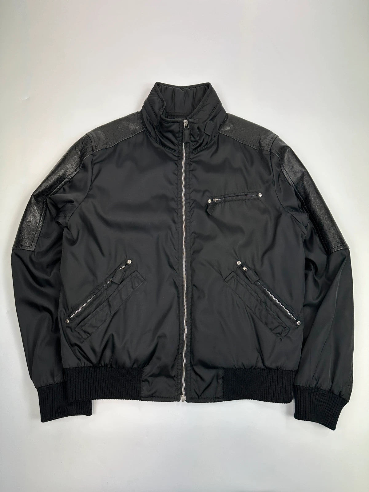 Prada black bomber jacket with leather details and hidden hood from FW2009 collection.
