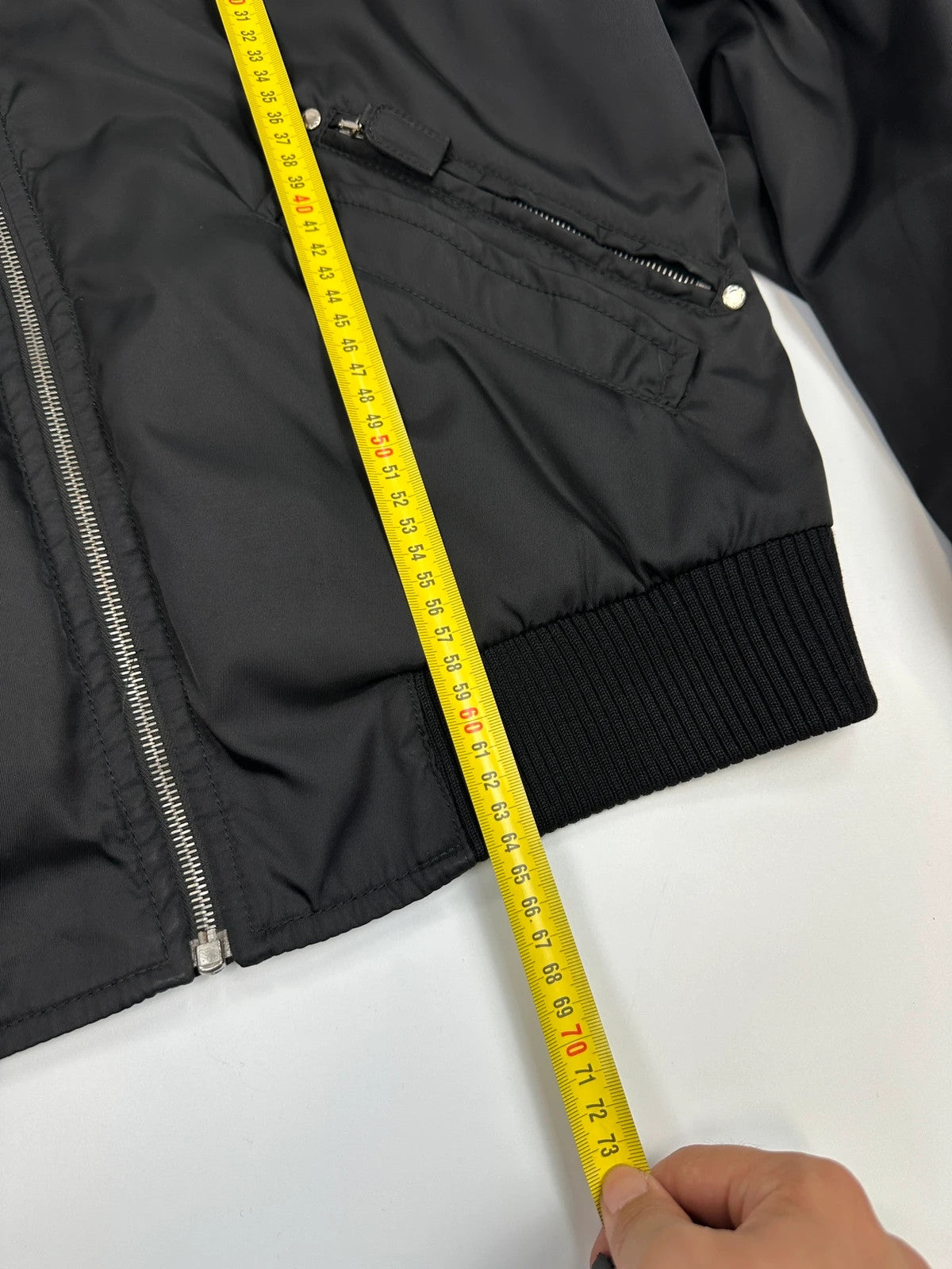 Prada black bomber jacket with leather details and hidden hood from FW2009 collection.