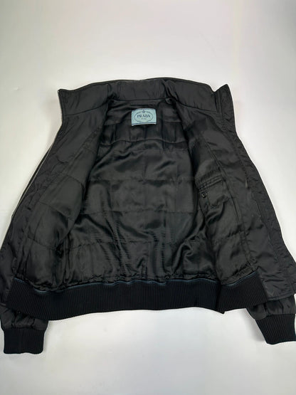 Prada black bomber jacket with leather details and hidden hood from FW2009 collection.