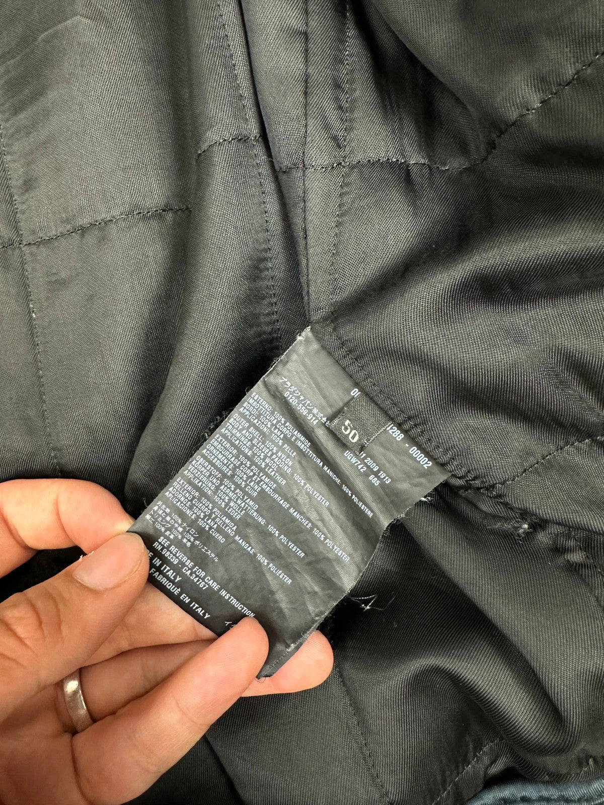 Prada black bomber jacket with leather details and hidden hood from FW2009 collection.