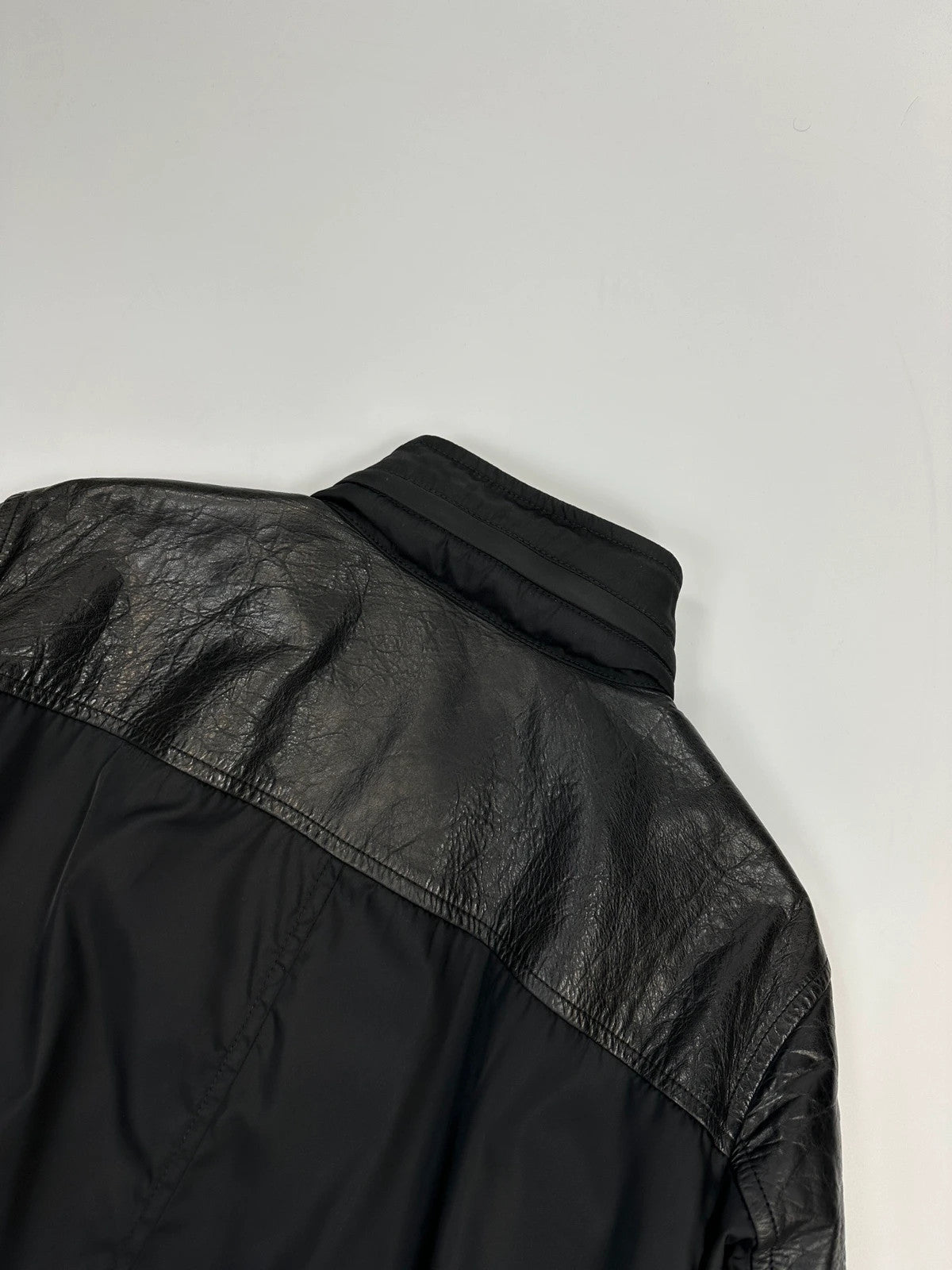 Prada black bomber jacket with leather details and hidden hood from FW2009 collection.