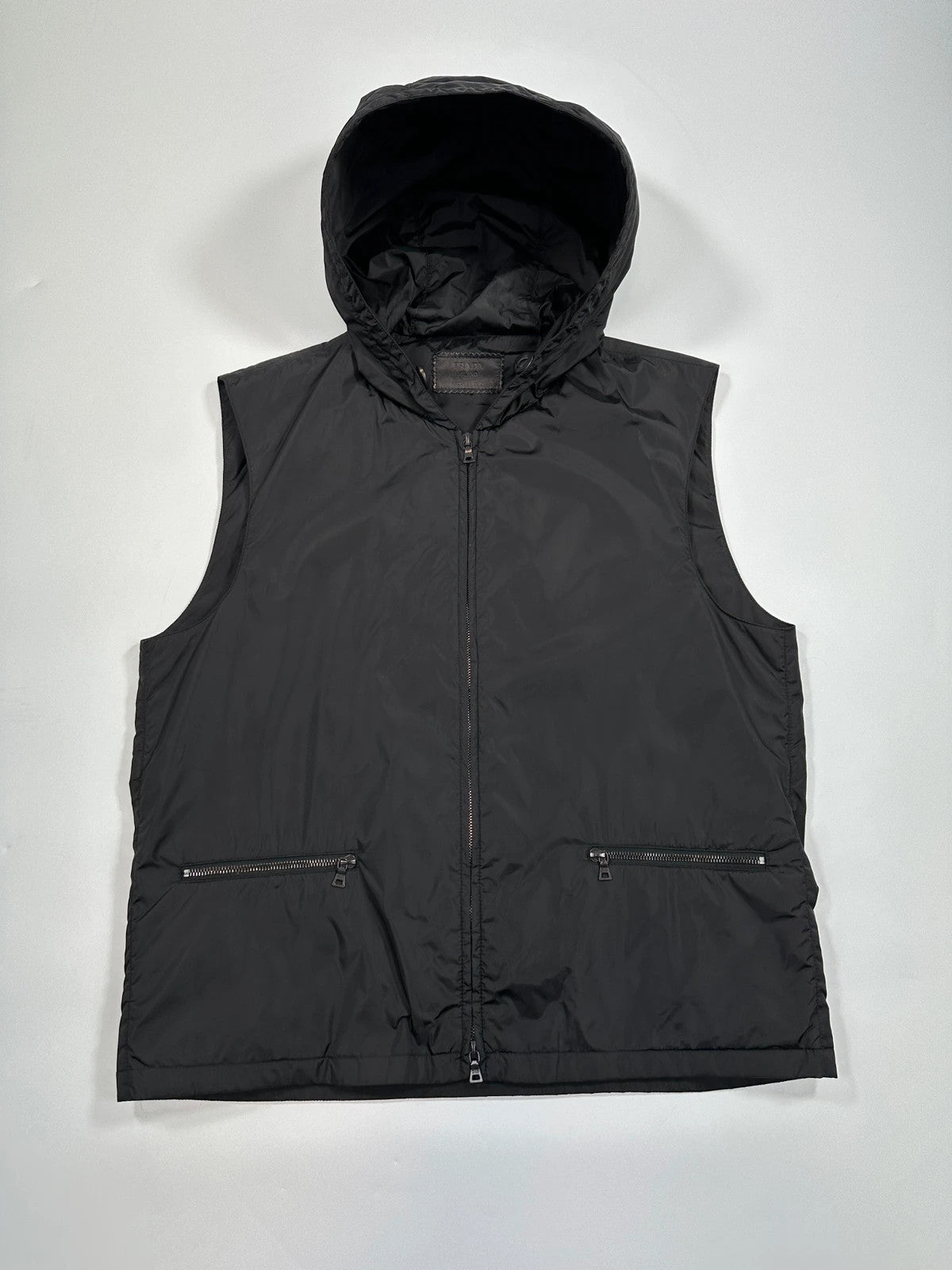 Prada black padded vest, nylon material, minimalist design, vintage 2003 collection.