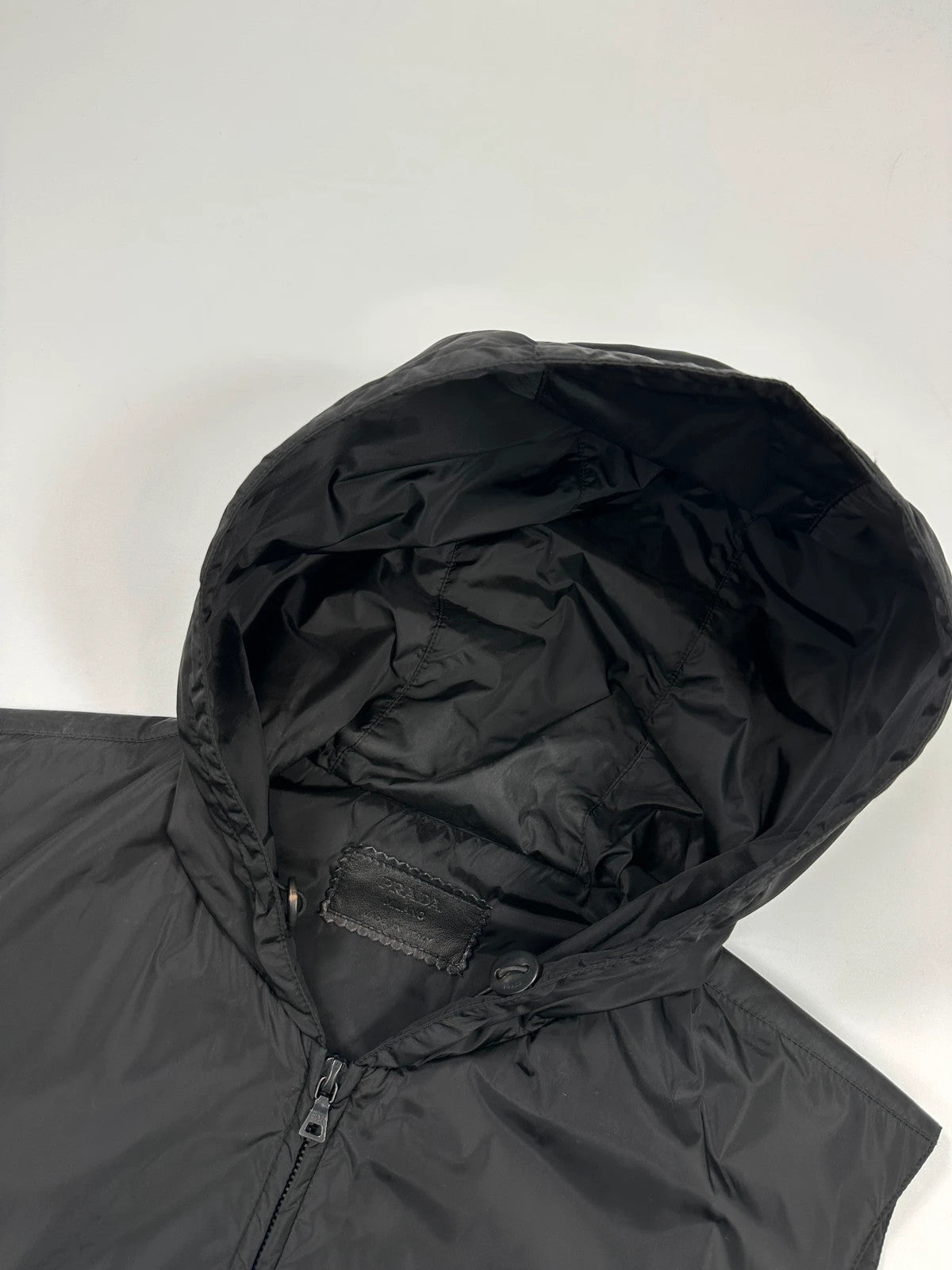 Prada black padded vest, nylon material, minimalist design, vintage 2003 collection.
