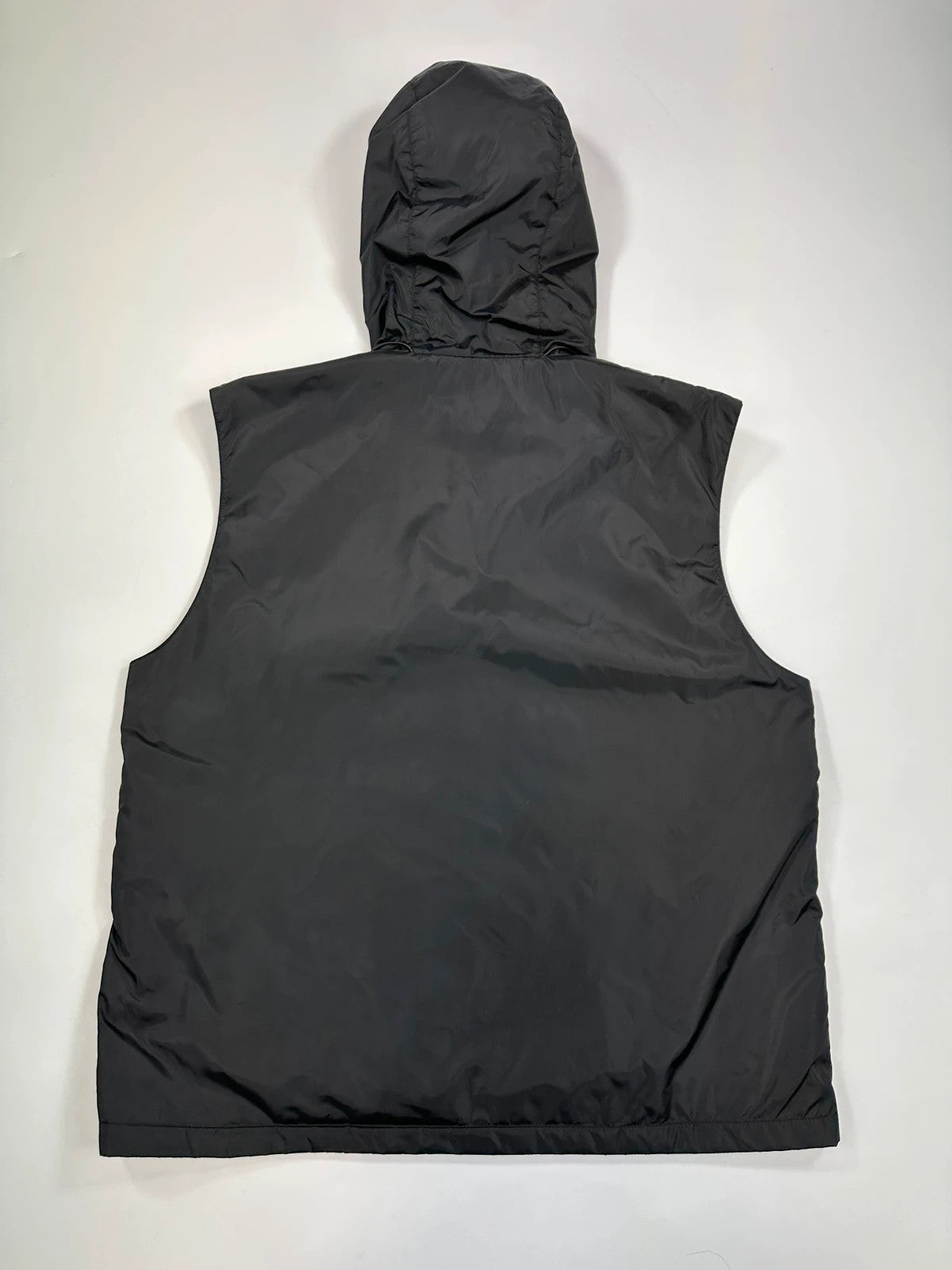 Prada black padded vest, nylon material, minimalist design, vintage 2003 collection.