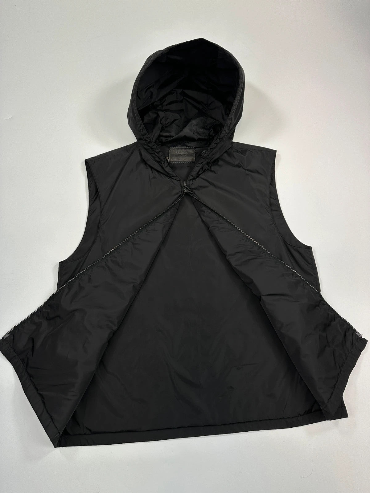 Prada black padded vest, nylon material, minimalist design, vintage 2003 collection.