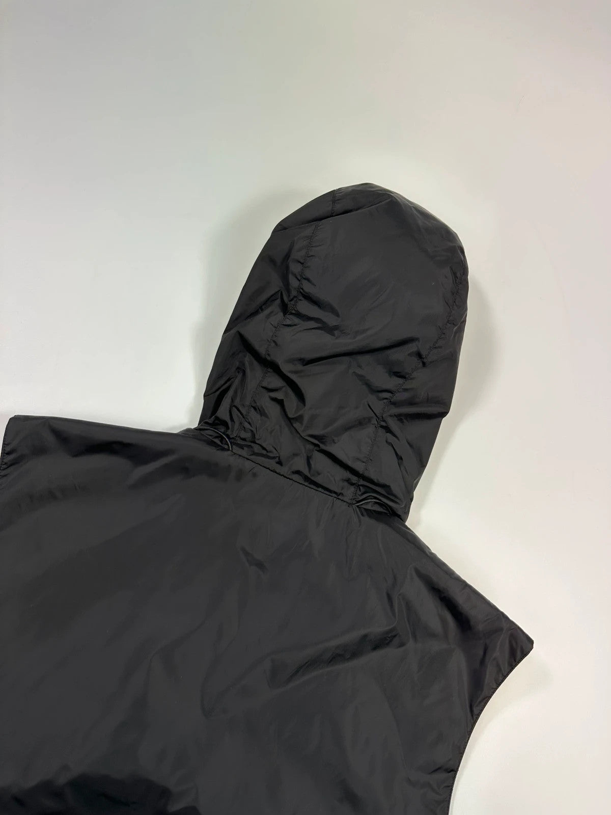 Prada black padded vest, nylon material, minimalist design, vintage 2003 collection.