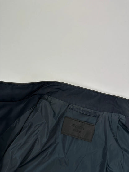 Prada bomber jacket navy blue nylon with reinforced details and minimalist design.