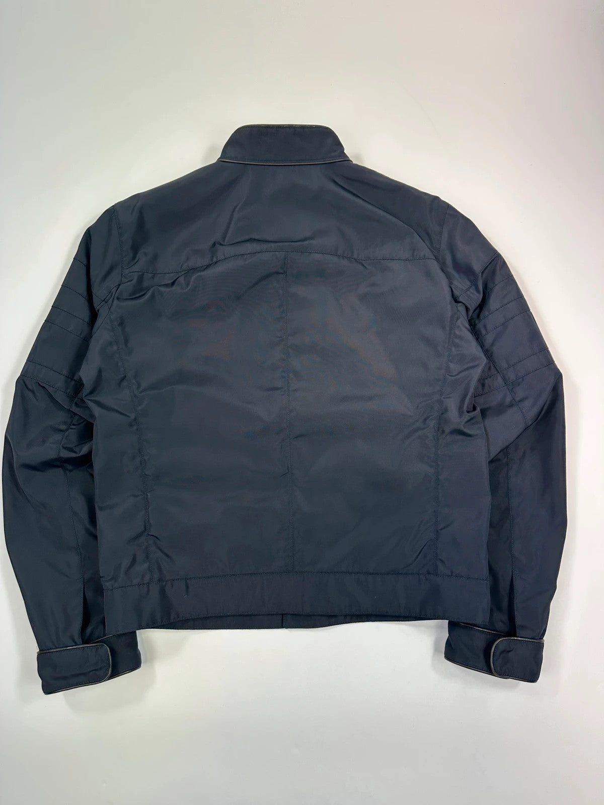 Prada bomber jacket navy blue nylon with reinforced details and minimalist design.