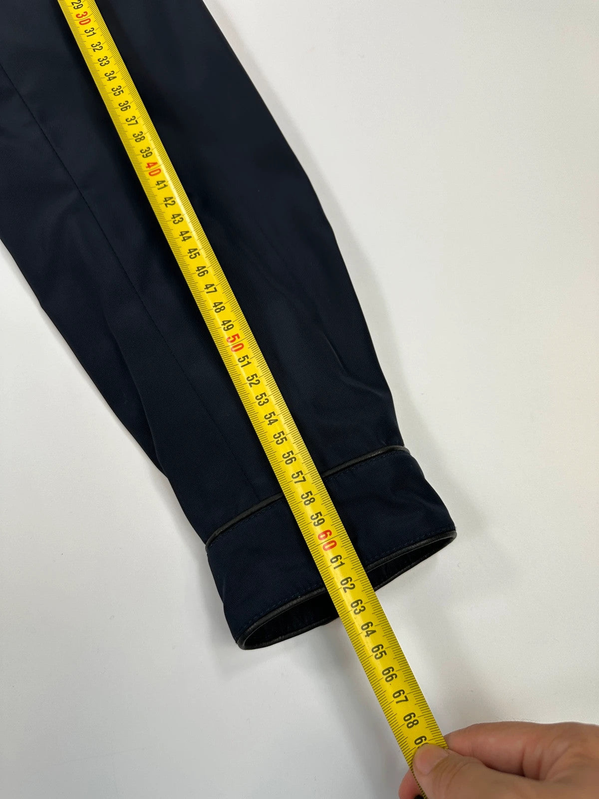 Prada bomber jacket navy blue nylon with reinforced details and minimalist design.