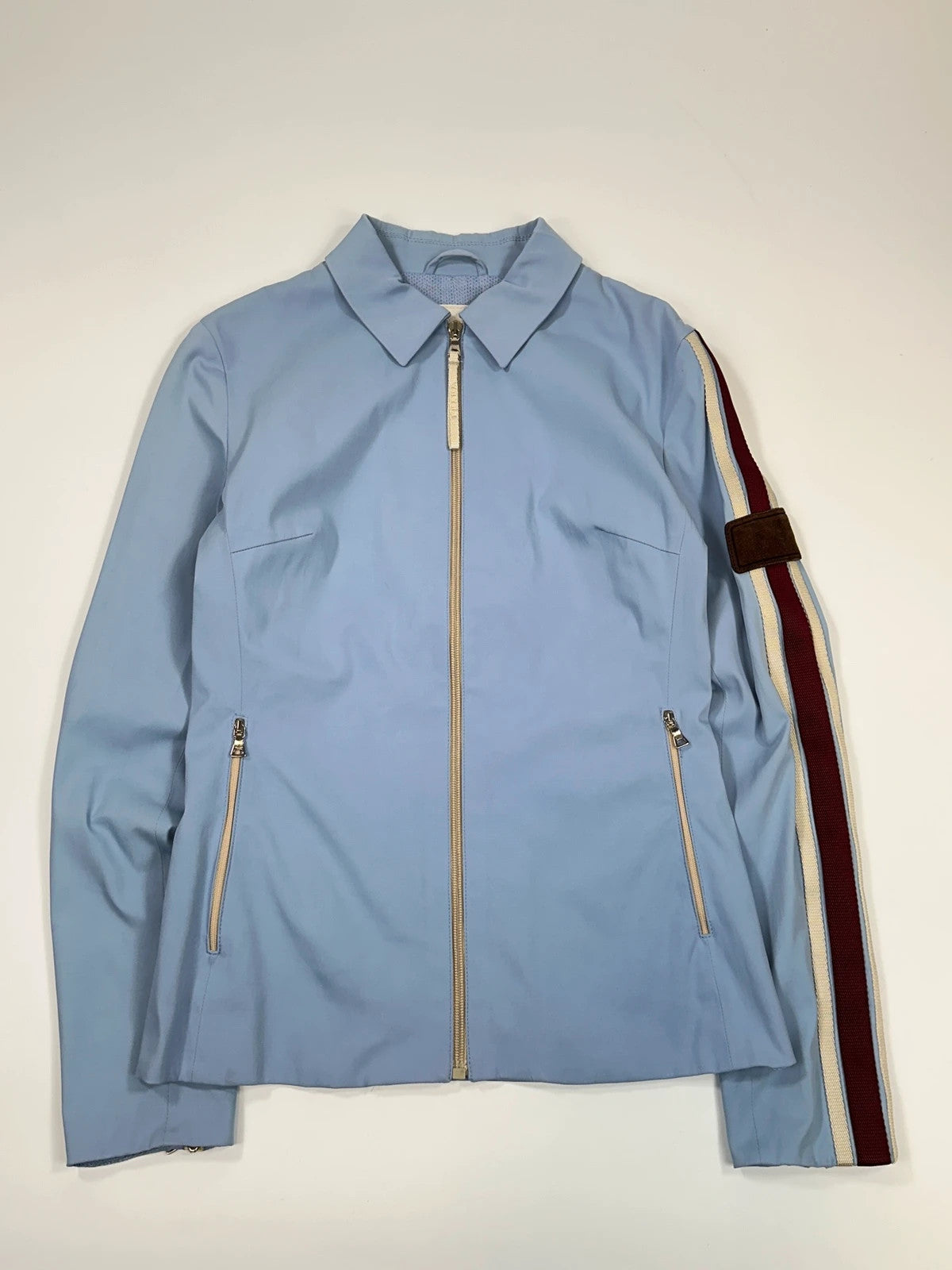 Prada blue striped jacket in nylon and silk with logo detailing.