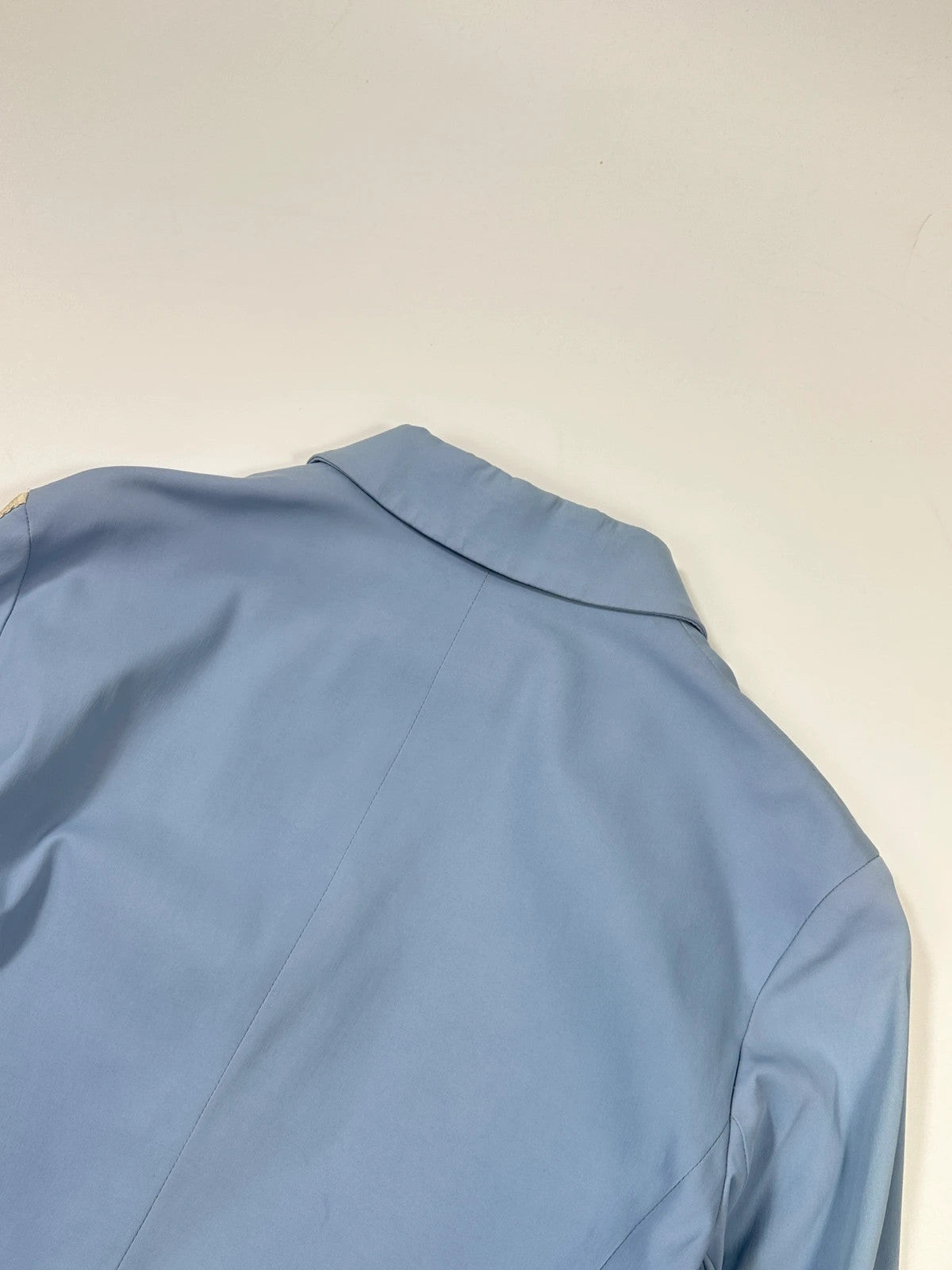 Prada blue striped jacket in nylon and silk with logo detailing.