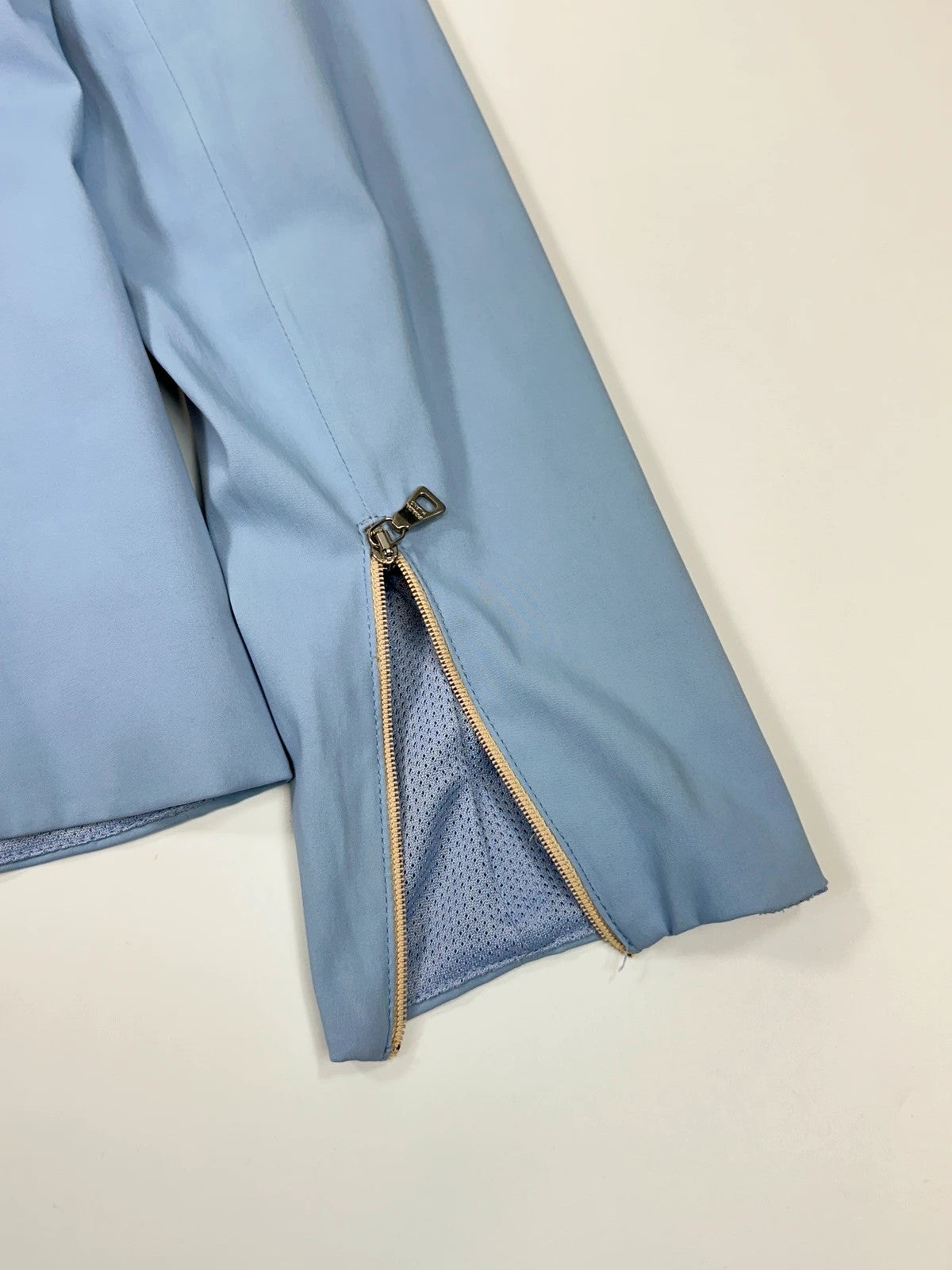 Prada blue striped jacket in nylon and silk with logo detailing.