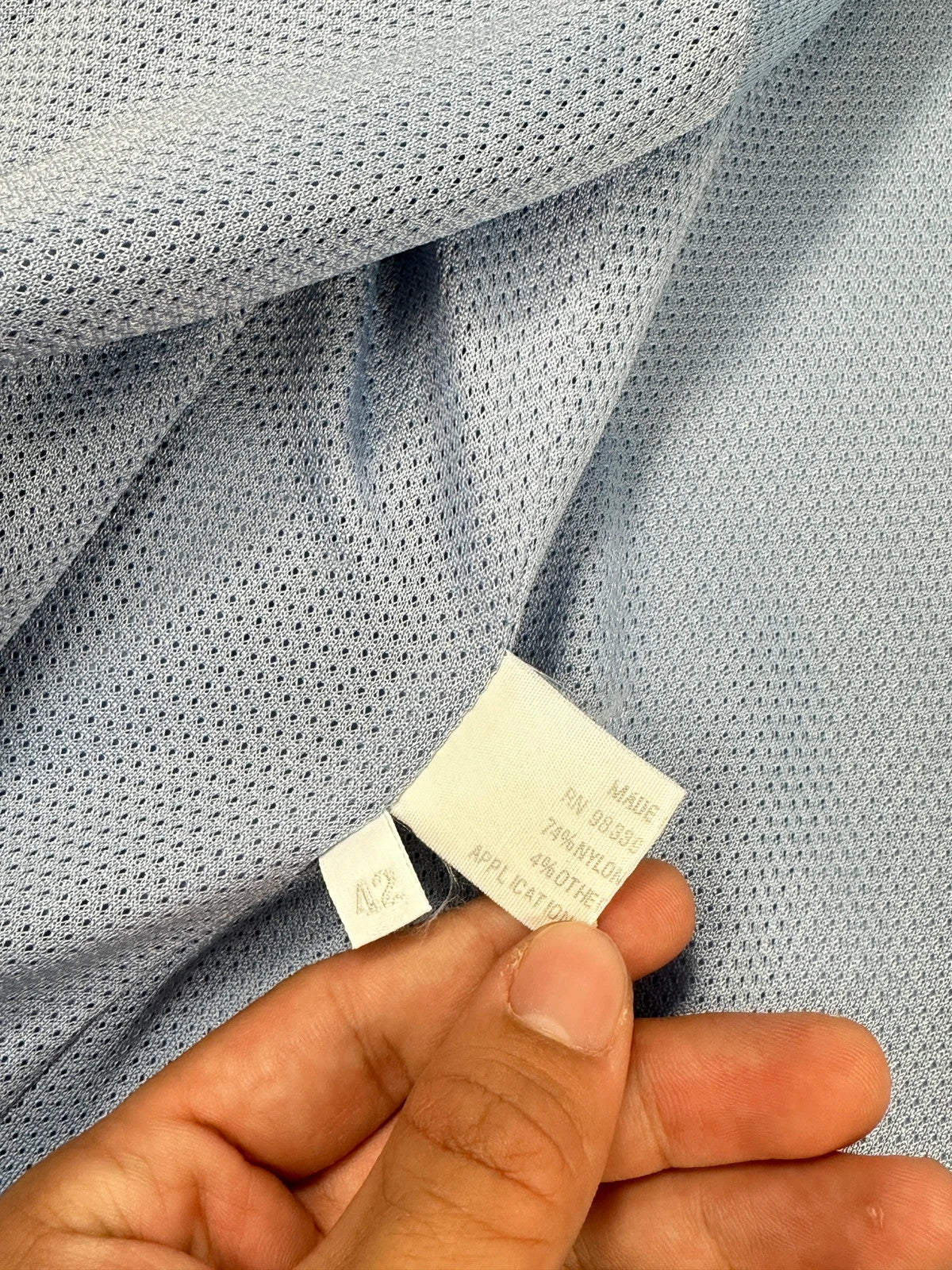 Prada blue striped jacket in nylon and silk with logo detailing.