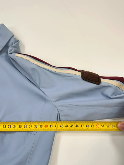 Prada blue striped jacket in nylon and silk with logo detailing.