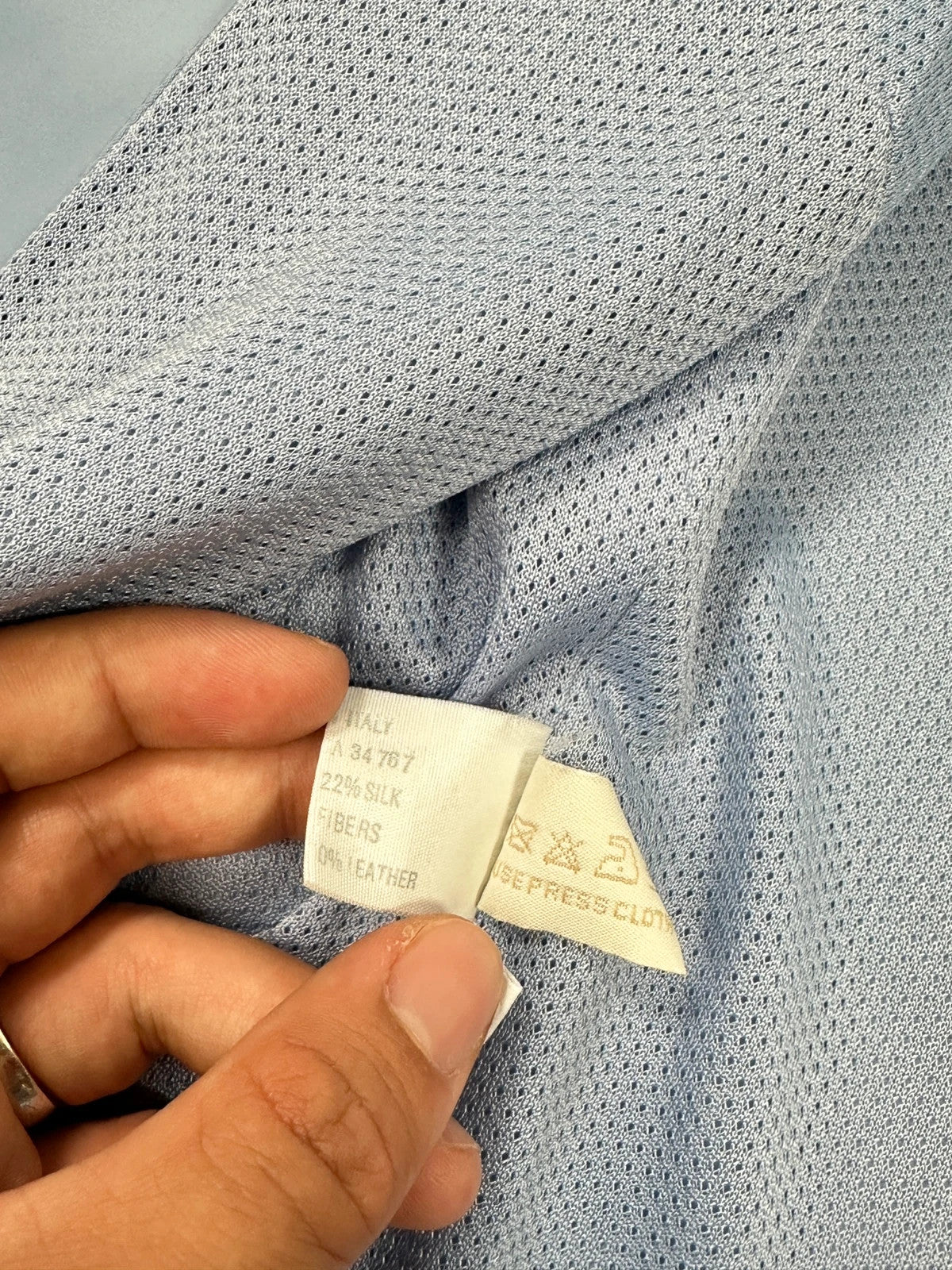 Prada blue striped jacket in nylon and silk with logo detailing.