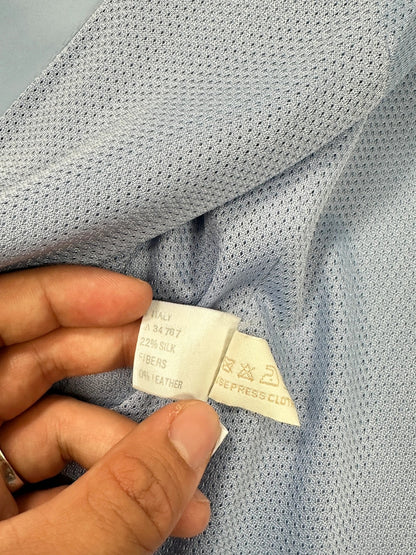 Prada blue striped jacket in nylon and silk with logo detailing.
