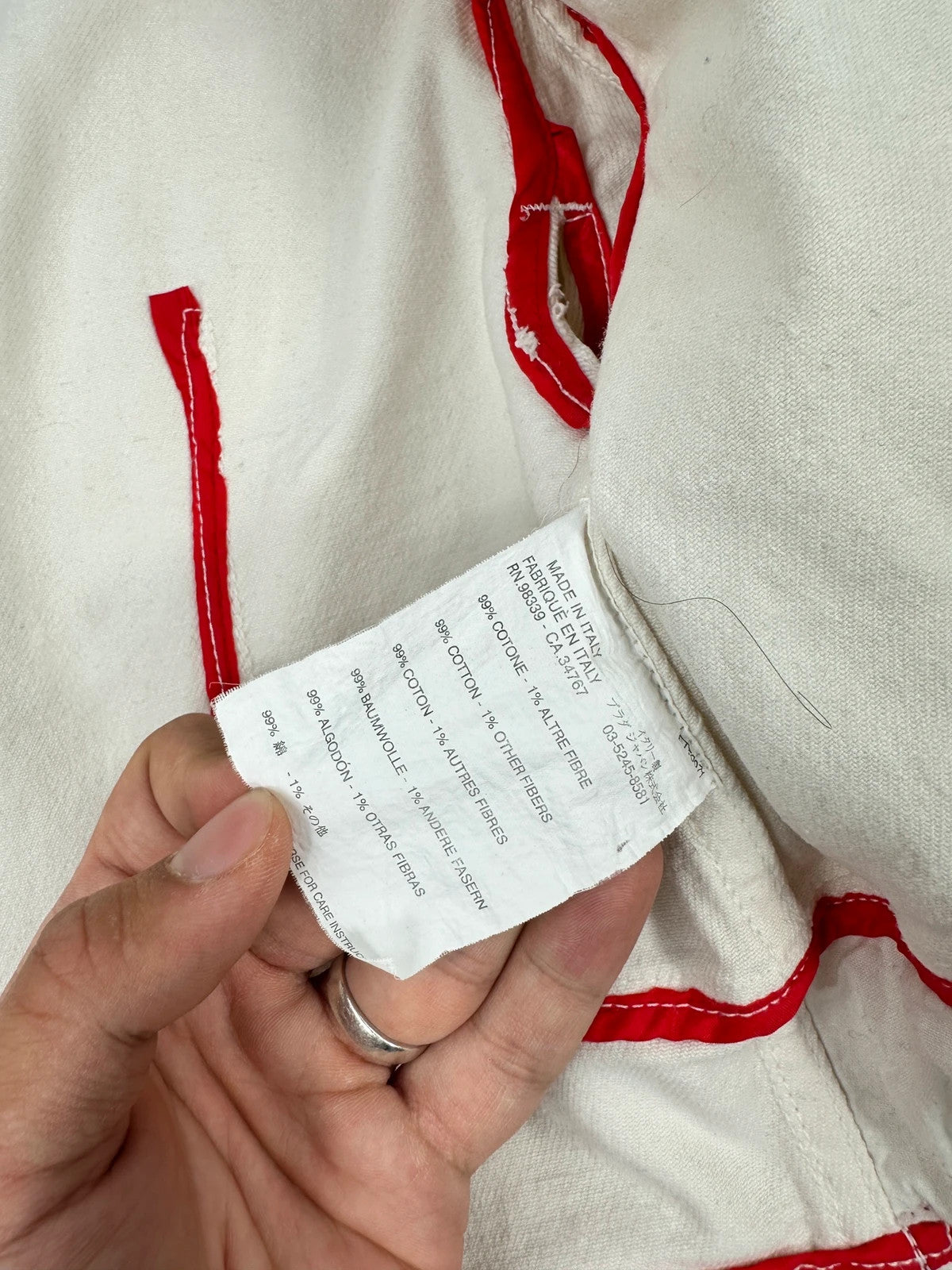 Prada brown and white denim jacket with lace detailing and faded wash effect.