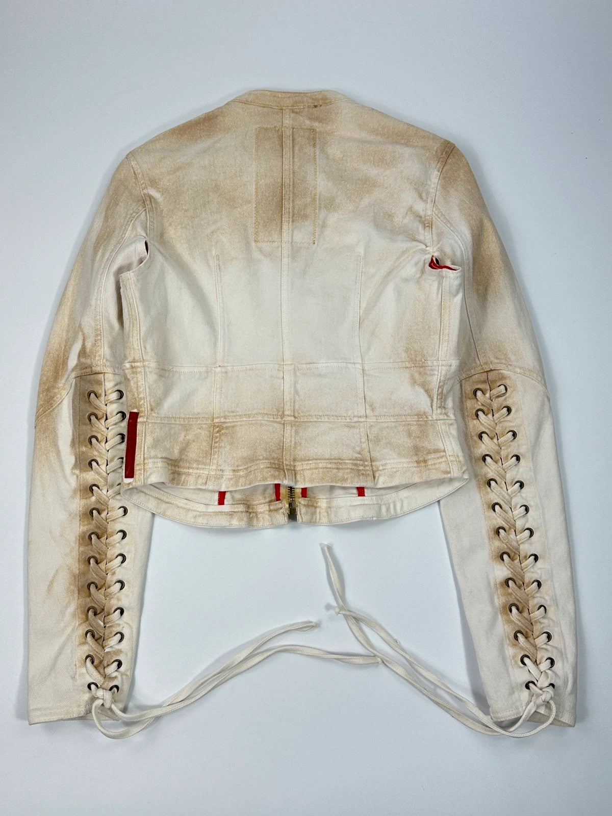 Prada brown and white denim jacket with lace detailing and faded wash effect.
