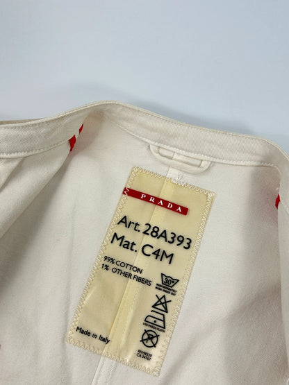 Prada brown and white denim jacket with lace detailing and faded wash effect.
