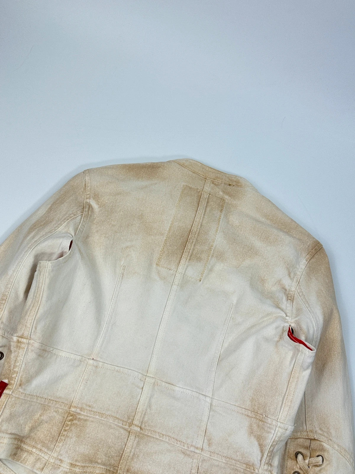 Prada brown and white denim jacket with lace detailing and faded wash effect.