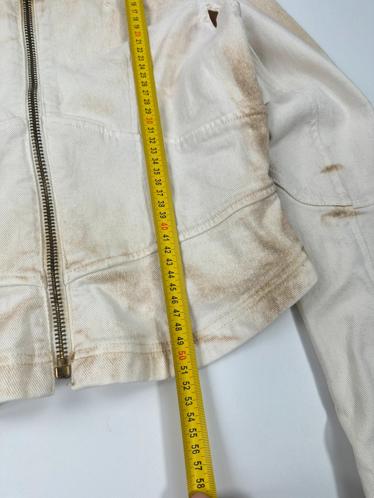 Prada brown and white denim jacket with lace detailing and faded wash effect.