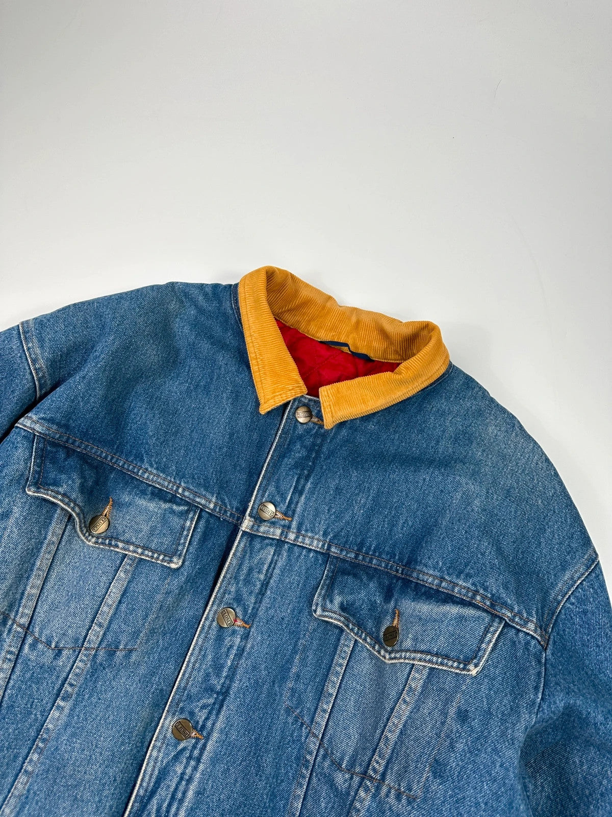 Marithé François Girbaud blue and red reversible denim bomber jacket with logo details.