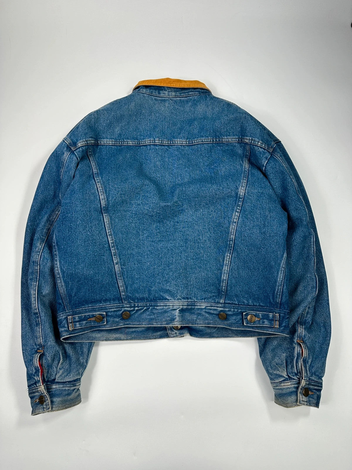 Marithé François Girbaud blue and red reversible denim bomber jacket with logo details.