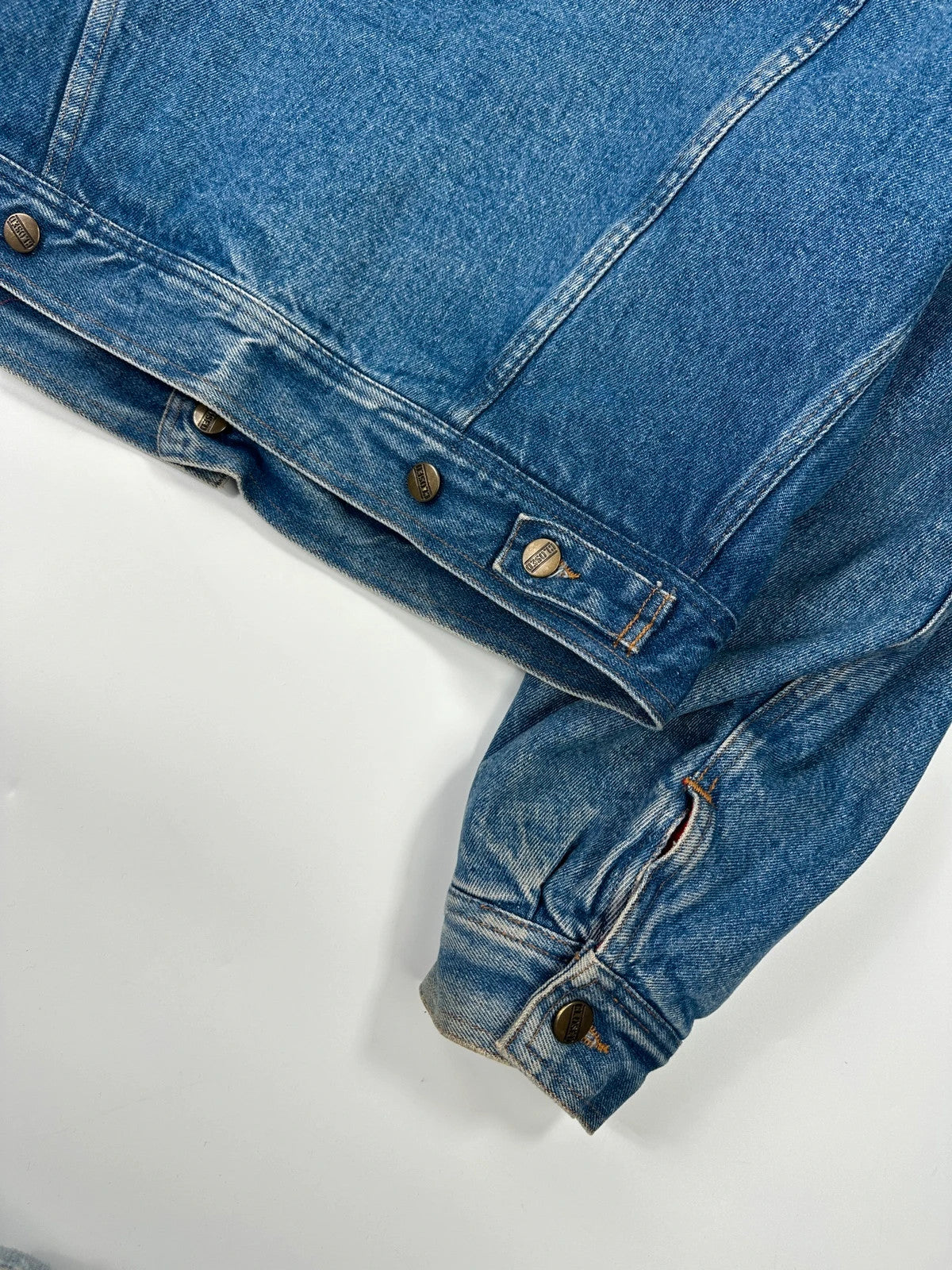 Marithé François Girbaud blue and red reversible denim bomber jacket with logo details.