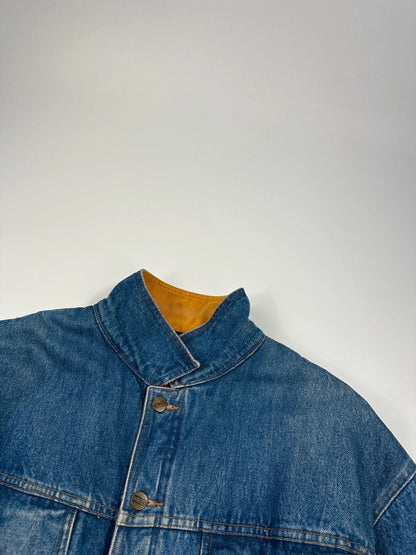 Marithé François Girbaud blue and red reversible denim bomber jacket with logo details.