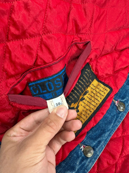 Marithé François Girbaud blue and red reversible denim bomber jacket with logo details.