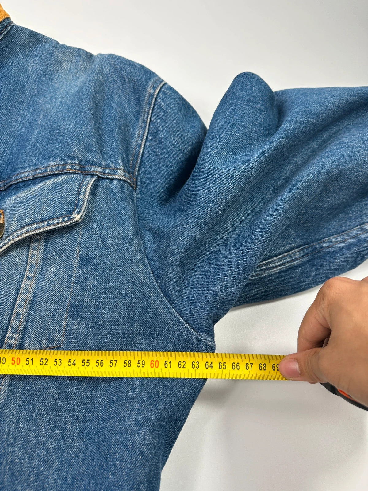 Marithé François Girbaud blue and red reversible denim bomber jacket with logo details.