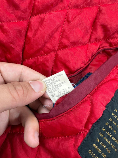 Marithé François Girbaud blue and red reversible denim bomber jacket with logo details.