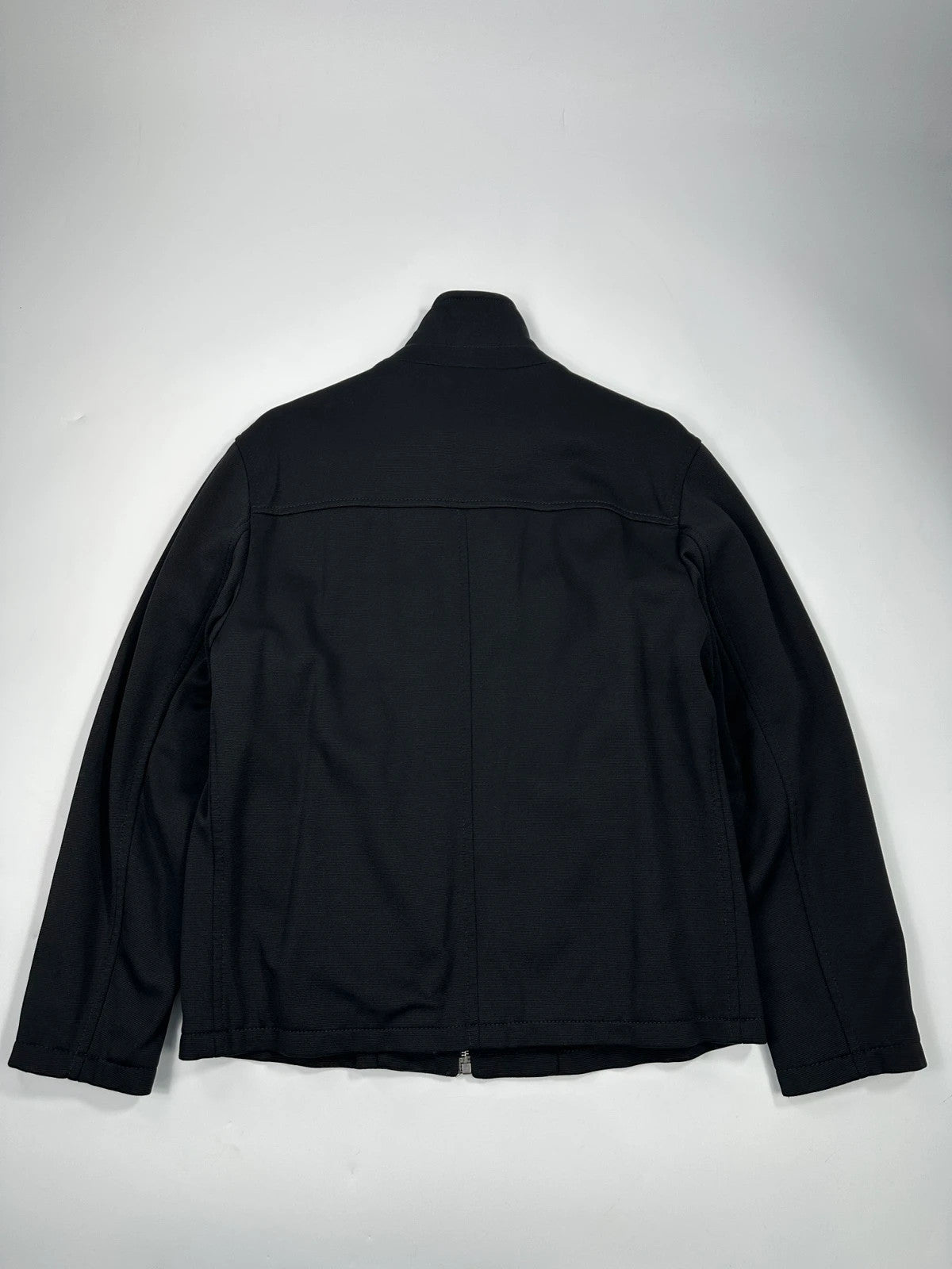 Prada black nylon Harrington bomber jacket with padded lining and vintage logo details.