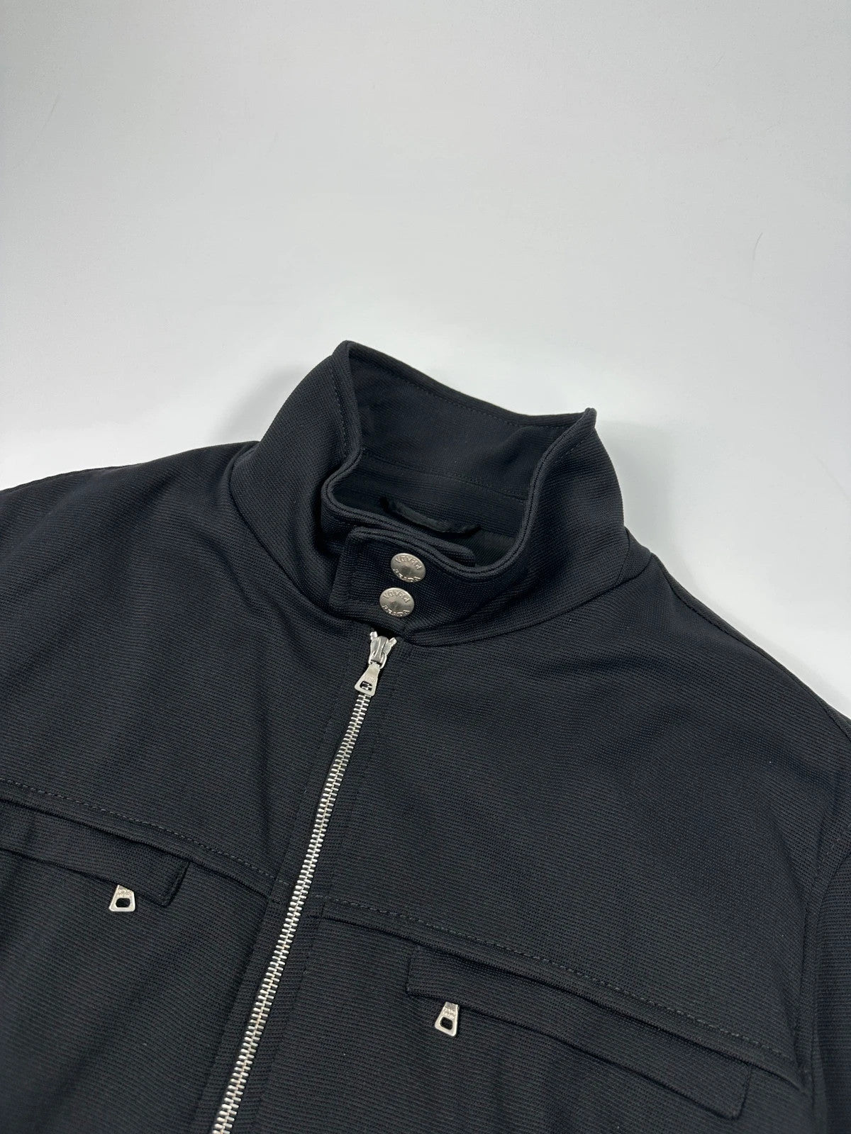 Prada black nylon Harrington bomber jacket with padded lining and vintage logo details.