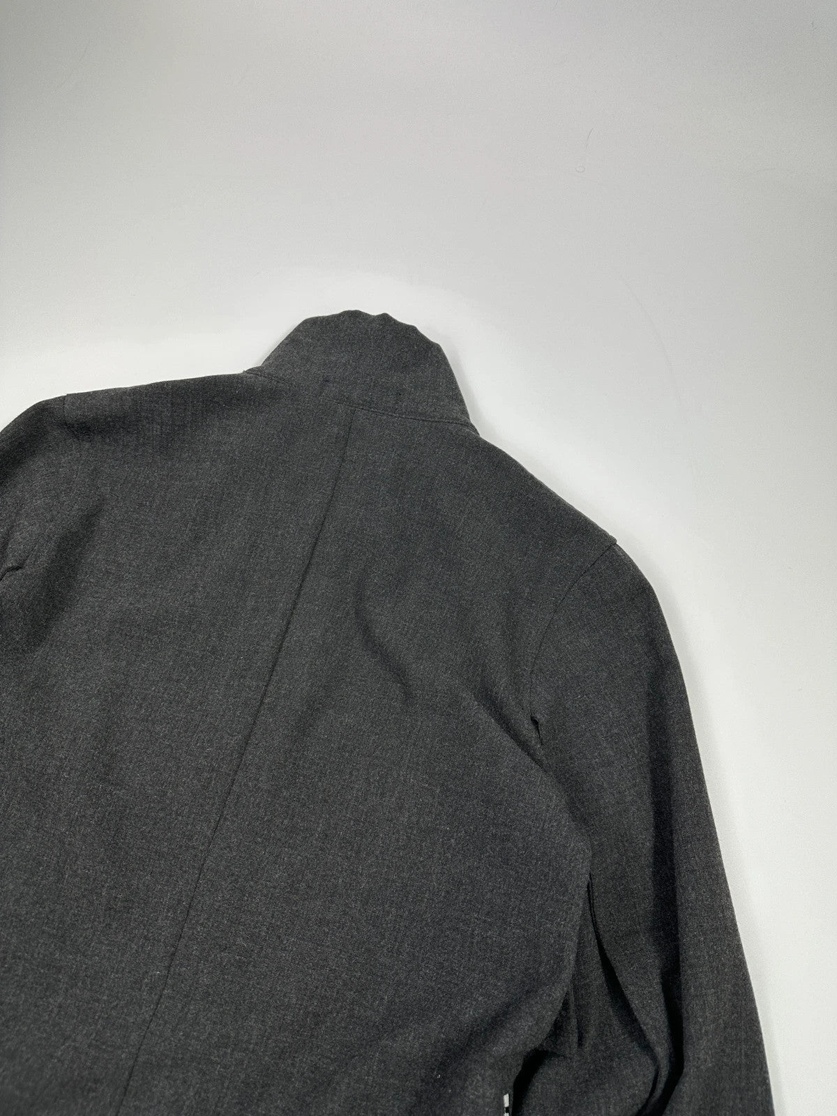 Marithé François Girbaud grey tech jacket with side zippers and minimalist design.