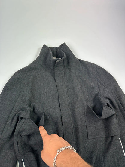 Marithé François Girbaud grey tech jacket with side zippers and minimalist design.