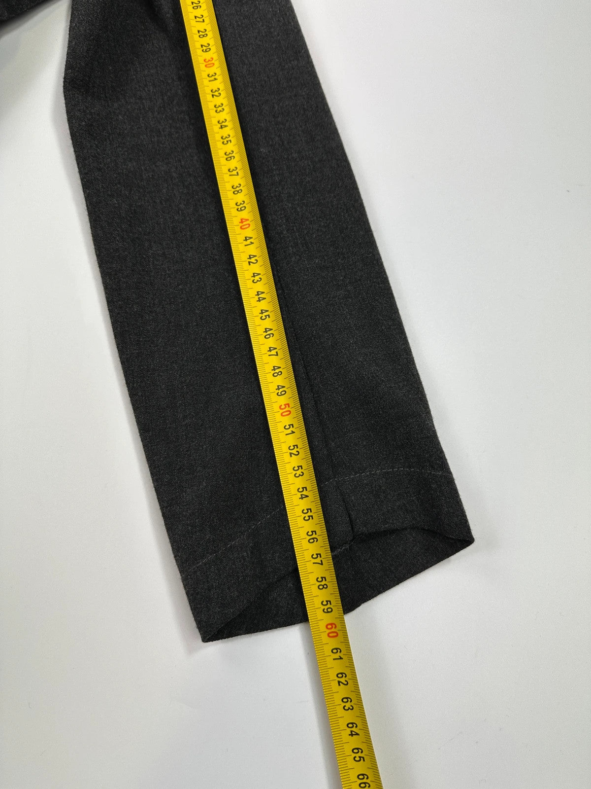 Marithé François Girbaud grey tech jacket with side zippers and minimalist design.