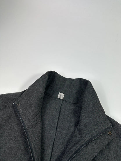 Marithé François Girbaud grey tech jacket with side zippers and minimalist design.