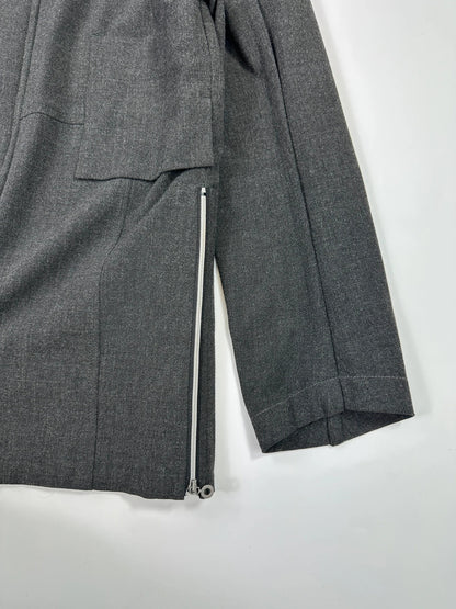 Marithé François Girbaud grey tech jacket with side zippers and minimalist design.