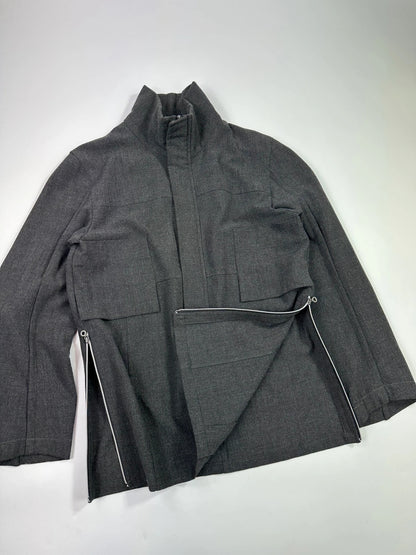 Marithé François Girbaud grey tech jacket with side zippers and minimalist design.