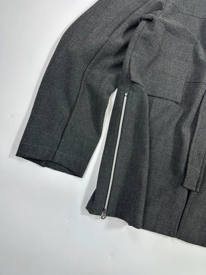 Marithé François Girbaud grey tech jacket with side zippers and minimalist design.