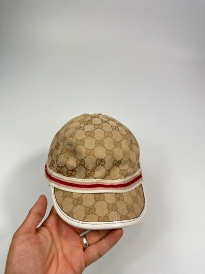 Gucci baseball cap in pink beige with GG monogram pattern and logo.